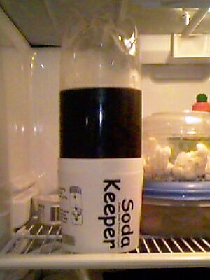 Soda Keeper on a Refrigerator Shelf